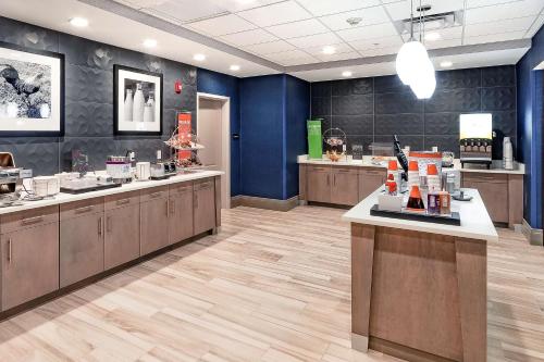 a hair salon with blue walls and wooden counters at Hampton Inn Lockport - Buffalo, NY in Lockport