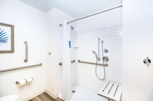 a bathroom with a shower and a toilet at Hampton Inn & Suites Panama City Beach-Beachfront in Panama City Beach