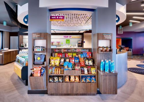 a store with a display of food and drinks at Tru By Hilton St. George in St. George
