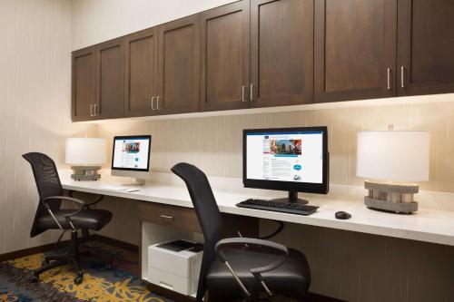 an office with two computers on a desk with two chairs at Hampton Inn Salt Lake City Cottonwood in Holladay
