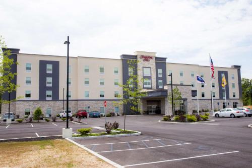 a large building with cars parked in a parking lot at Hampton Inn Atlantic City/Absecon, NJ in Absecon