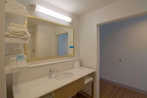 a bathroom with a sink and a mirror at Hampton Inn Crestview South I-10, Fl in Crestview
