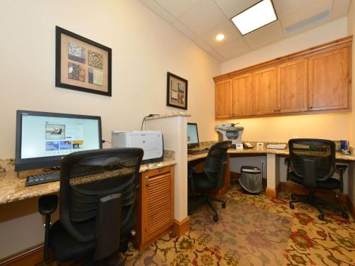 an office with a desk with a computer and chairs at Hampton Inn & Suites Buffalo in Buffalo