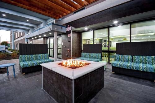 a fire pit in the middle of a patio at Home2 Suites By Hilton Fort Worth Fossil Creek in Fort Worth