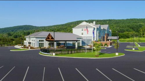 a rendering of a building in a parking lot at Hilton Garden Inn Hanover Lebanon in Lebanon