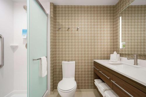 a bathroom with a toilet and a sink at Home2 Suites By Hilton Warminster Horsham in Warminster