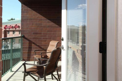 two chairs sitting on the balcony of a building at Hampton Inn Richland-Tri Cities in Richland