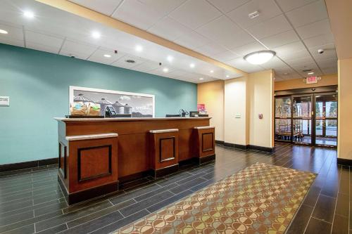 a waiting area in a hospital lobby with a desk at Hampton Inn Pine Grove in Pine Grove