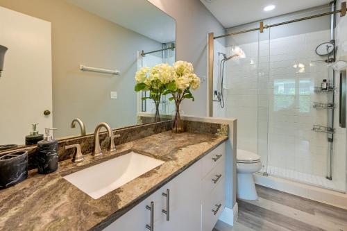 a bathroom with a sink and a toilet and a shower at Bonita Springs Home with Pool - 2 Mi to Beach! in Bonita Springs