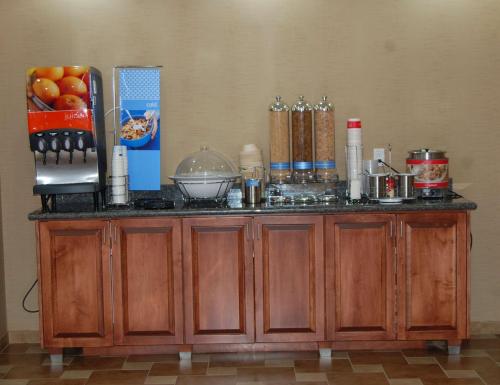 a wooden counter with ingredients on top of it at Hampton Inn Sidney in Sidney