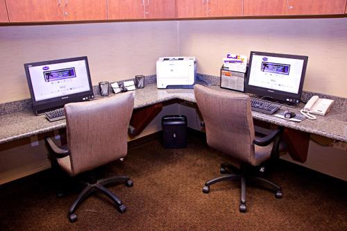 an office cubicle with two computers on a desk at Hampton Inn Sidney in Sidney