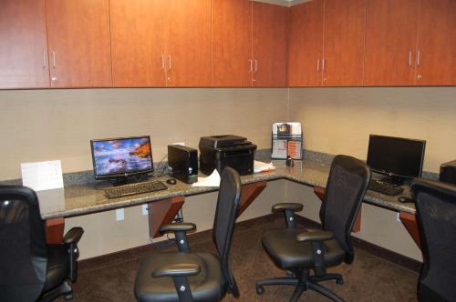 an office with a desk with two computers and chairs at Hampton Inn Sidney in Sidney