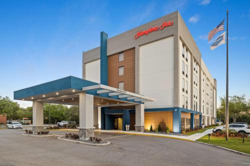 a store front of a shopping center with an american mall at Hampton Inn Tampa-Veterans Expressway in Tampa