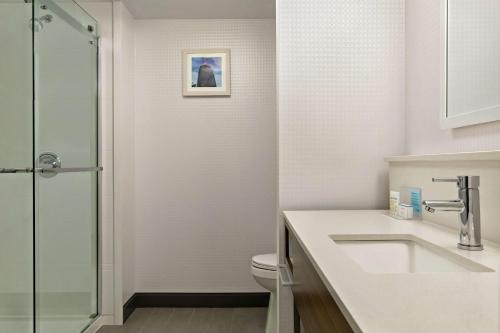 a bathroom with a sink and a toilet at Hampton Inn London Ontario in London