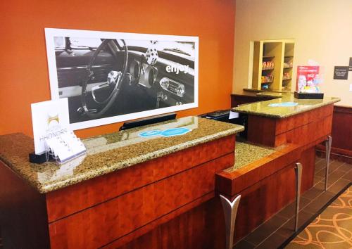 a hotel room with a picture of a car on the wall at Hampton Inn & Suites Chesapeake-Battlefield Boulevard in Chesapeake
