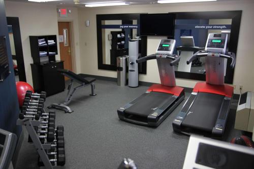 a gym with two treadmills and exercise machines at Hampton Inn & Suites Chillicothe in Chillicothe
