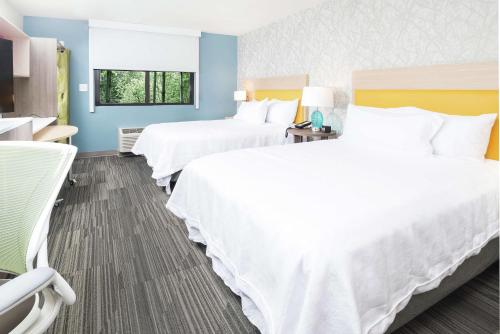 a hotel room with two beds and a window at Home2 Suites By Hilton King Of Prussia Valley Forge in King of Prussia