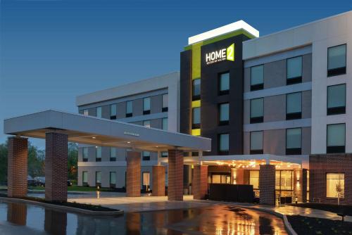 a rendering of the front of a hotel at Home2 Suites By Hilton Indianapolis Airport in Indianapolis