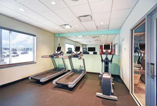 a gym with cardio machines in a room with a window at Tru By Hilton Portland Airport Area Me in South Portland
