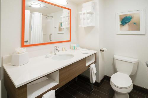 a bathroom with a white sink and a toilet at Hampton Inn Clarks Summit in Clarks Summit