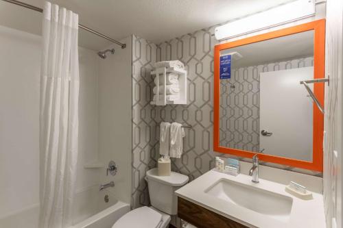 a bathroom with a toilet and a sink and a shower at Hampton Inn Madison East Towne Mall Area in Madison