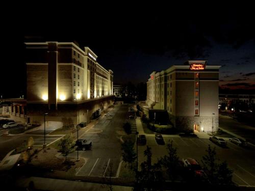 a night view of a building with a hotel at Hampton Inn & Suites Raleigh-Durham Airport-Brier Creek in Raleigh