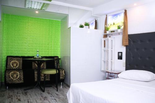 Кровать или кровати в номере Mamba Hotel
