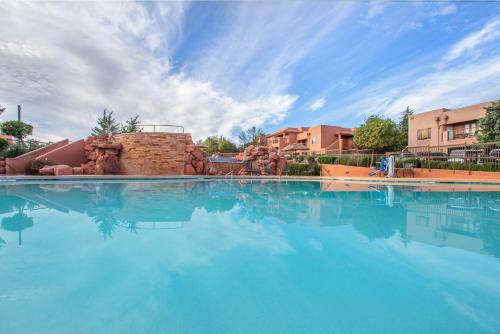a swimming pool with blue water in a resort at Hilton Vacation Club Sedona Summit in Sedona
