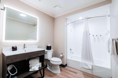 a bathroom with a sink and a toilet and a shower at Hotel NoBo Cascade, Tapestry Collection by Hilton in Cascade