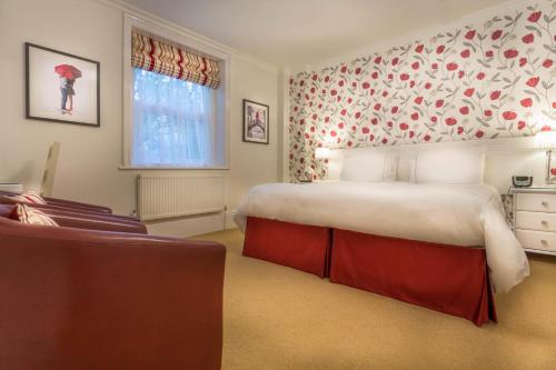 
a bedroom with a large bed and a large window at Balincourt in Bournemouth
