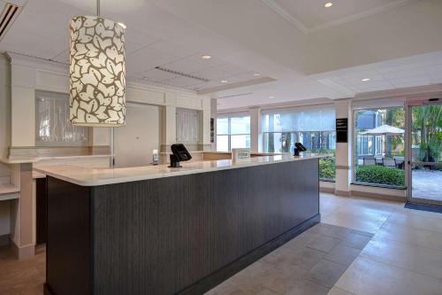a large kitchen with a large island in a house at Hilton Garden Inn Fort Myers in Fort Myers