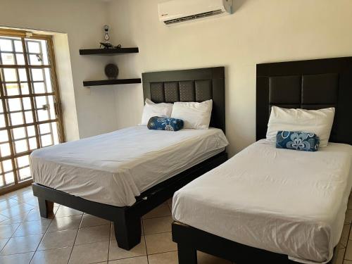 Postel nebo postele na pokoji v ubytování Casa grande con alberca a pasos de Hospital San José