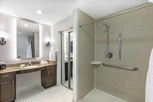 a bathroom with a shower and a sink at Homewood Suites by Hilton Waco in Waco
