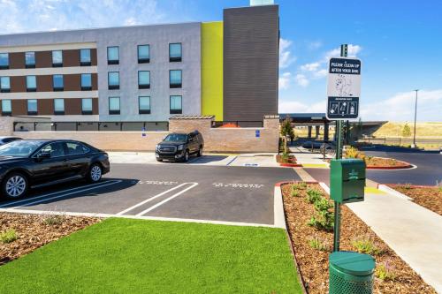 a car parked in a parking lot in front of a building at Home2 Suites By Hilton Roseville Sacramento in Roseville
