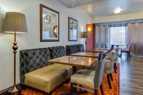 a waiting room with tables and chairs in a hotel room at Hampton Inn Johnson City in Johnson City