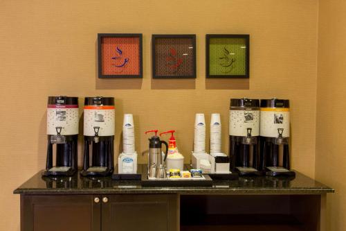 a counter with a bunch of bottles on a table at Hampton Inn & Suites Albany-Downtown in Albany