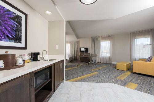 a large room with a kitchen and a living room at Hampton Inn & Suites West Lafayette, In in West Lafayette