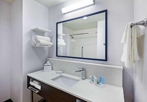 a white bathroom with a sink and a mirror at Hampton Inn By Hilton Bulverde Texas Hill Country in Bulverde
