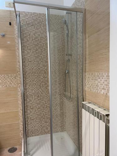 a shower with a glass door in a bathroom at Signorina In Rome in Rome