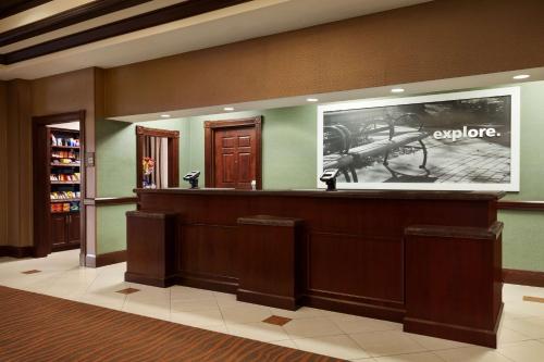 a waiting room with a large picture of a gun at Hampton Inn & Suites Washington-Dulles International Airport in Sterling