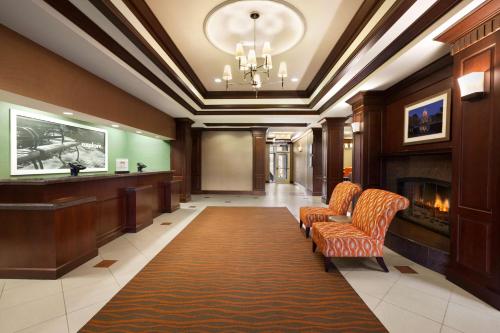 a lobby with a fireplace and a waiting room at Hampton Inn & Suites Washington-Dulles International Airport in Sterling