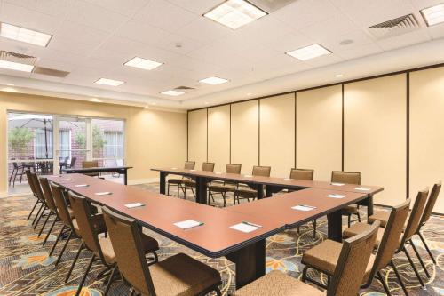 a conference room with a long table and chairs at Homewood Suites Atlanta Airport North in Atlanta