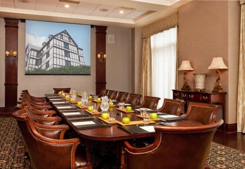 a large conference room with a long table and chairs at Hotel Roanoke & Conference Center, Curio Collection by Hilton in Roanoke