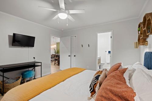 a bedroom with a bed and a ceiling fan at Near Biltmore, Hiking, Breweries W Game Room in Fletcher