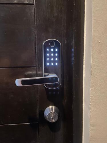 a close up of a door with a key card on it at FLY & REST GUESTHOUSE - Mactan-Cebu International Airport in Lapu Lapu City