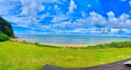 a view of the beach from the house at エコヴィレッジ西表 Eco Village Iriomote in Iriomote