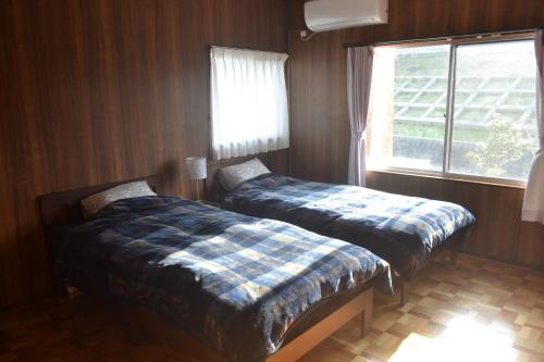 Кровать или кровати в номере Imari - House / Vacation STAY 3867