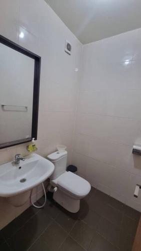 a bathroom with a white toilet and a sink at F5 -5 bedrooms Apt- Residence Hasnaoui avec parking Oran Algeria in Oran