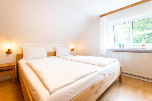 Ένα ή περισσότερα κρεβάτια σε δωμάτιο στο Appartement FLÖR