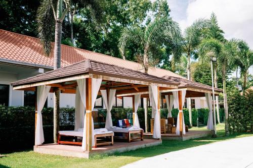 a gazebo in the yard of a house at 3 Peaks Resort & Boutique Hotel in Lipa